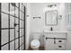 Updated bathroom boasts a glass-enclosed shower, modern vanity, and stylish fixtures, enhancing its appeal at 2423 Melinda Ne Dr, Atlanta, GA 30345