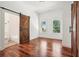 Bright bedroom with hardwood floors and en-suite bathroom, creating a serene and inviting space at 2423 Melinda Ne Dr, Atlanta, GA 30345