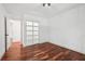 White bedroom with bright light and wood floors at 2423 Melinda Ne Dr, Atlanta, GA 30345