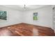 Bright room with hardwood floors and two windows at 2423 Melinda Ne Dr, Atlanta, GA 30345