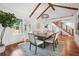 Bright dining room with hardwood floors, a modern light fixture and adjacent staircase at 2423 Melinda Ne Dr, Atlanta, GA 30345