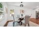 Cozy dining space with hardwood floors, natural light and a modern light fixture at 2423 Melinda Ne Dr, Atlanta, GA 30345