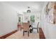 Bright dining room with natural light, hardwood floors, and a round glass table at 2423 Melinda Ne Dr, Atlanta, GA 30345