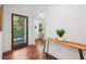 Bright foyer with hardwood floors and a decorative table creates a warm welcome with an open doorway to the living room at 2423 Melinda Ne Dr, Atlanta, GA 30345