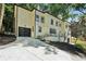 Stylish two-story home with clean lines, black framed windows, and a private driveway offers an appealing curb presence at 2423 Melinda Ne Dr, Atlanta, GA 30345