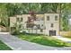 Beautiful two-story home with a lush green lawn and a private driveway offers curb appeal at 2423 Melinda Ne Dr, Atlanta, GA 30345