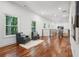 Spacious hallway features hardwood floors, natural light, and comfortable seating, perfect for relaxing at 2423 Melinda Ne Dr, Atlanta, GA 30345