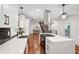 Open concept kitchen with island, stainless hood, and view of the staircase at 2423 Melinda Ne Dr, Atlanta, GA 30345