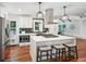 Updated kitchen features stainless appliances, island seating, modern vent hood and lighting at 2423 Melinda Ne Dr, Atlanta, GA 30345