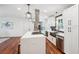 Modern kitchen boasts a center island, stainless steel appliances, and dark backsplash at 2423 Melinda Ne Dr, Atlanta, GA 30345