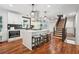 Kitchen with seating at the island and access to the upper floor at 2423 Melinda Ne Dr, Atlanta, GA 30345