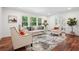 Inviting living room with hardwood floors and modern furniture complemented by bright windows and stylish decor at 2423 Melinda Ne Dr, Atlanta, GA 30345