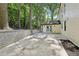 Spacious backyard patio with mature trees and attractive retaining wall at 2423 Melinda Ne Dr, Atlanta, GA 30345
