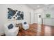 Upstairs sitting area featuring modern art, bright window and comfortable chairs at 2423 Melinda Ne Dr, Atlanta, GA 30345