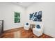 Cozy sitting area with wood floors, modern art, and bright window at 2423 Melinda Ne Dr, Atlanta, GA 30345