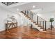 Entryway with unique staircase and wood floors at 2423 Melinda Ne Dr, Atlanta, GA 30345