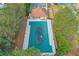 Aerial view of a community pool with a clubhouse and surrounding greenery at 3466 Northfield Nw Way, Kennesaw, GA 30144