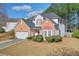 Beautiful two-story home with a brick facade, bay window, and manicured landscaping at 3466 Northfield Nw Way, Kennesaw, GA 30144