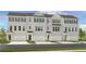 New construction townhome with gray brick, black shutters, and individual garage entries at 5841 Schelton Se Pl, Mableton, GA 30126
