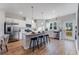 Open kitchen with island, bar stool seating, stainless steel appliances and backyard access at 5841 Schelton Se Pl, Mableton, GA 30126