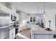 Kitchen featuring an island with counter seating, stainless steel appliances, and white cabinets at 5841 Schelton Se Pl, Mableton, GA 30126