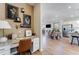 Cozy home office with granite desk, seamlessly connecting to an open living and kitchen space for flexible living at 5841 Schelton Se Pl, Mableton, GA 30126