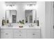 Contemporary bathroom featuring a double vanity, quartz counters, and modern lighting at 1048 Standard Ne Dr, Atlanta, GA 30319