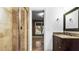 Bathroom with a brown single sink vanity and a beige tile shower at 1048 Standard Ne Dr, Atlanta, GA 30319