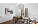 Dining area with modern light fixture, large windows, and seating for six around a wood table at 1048 Standard Ne Dr, Atlanta, GA 30319