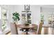 Bright dining room with windows, a wooden table and light wood chairs at 1048 Standard Ne Dr, Atlanta, GA 30319