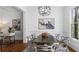 Dining room with modern decor and a large window allowing natural light, adjacent to a study area at 1048 Standard Ne Dr, Atlanta, GA 30319