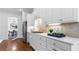 Clean white kitchen featuring stainless appliances, a modern design and hardwood flooring at 1048 Standard Ne Dr, Atlanta, GA 30319