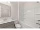 Bathroom featuring sink, mirror, toilet and tiled shower at 13238 Tolstoy, Covington, GA 30014