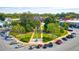 Aerial view of town square featuring lush greenery, parking, and surrounding buildings at 13238 Tolstoy, Covington, GA 30014