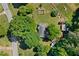 Aerial view of home featuring mature trees, fenced backyard and circular driveway at 4027 Finch Sw Rd, Powder Springs, GA 30127