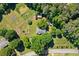 Aerial view of a home, manicured lawn and an established garden at 4027 Finch Sw Rd, Powder Springs, GA 30127