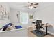 Neutral bedroom with a daybed and work space with a desk and chair at 4027 Finch Sw Rd, Powder Springs, GA 30127