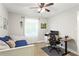 Neutral bedroom with a daybed and work space with a desk and chair at 4027 Finch Sw Rd, Powder Springs, GA 30127