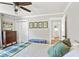 Bedroom featuring a calming color palette, artwork, and closet for storage at 4027 Finch Sw Rd, Powder Springs, GA 30127