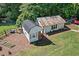 Expansive lot featuring a rustic home with an additional shed and garden at 4027 Finch Sw Rd, Powder Springs, GA 30127