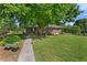 Single-story brick home with large front yard and walkway at 4027 Finch Sw Rd, Powder Springs, GA 30127