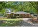 Brick home with large front yard and fenced yard at 4027 Finch Sw Rd, Powder Springs, GA 30127