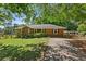 A traditional brick home with well-manicured lawn and fenced yard at 4027 Finch Sw Rd, Powder Springs, GA 30127