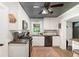 Well-equipped kitchen boasts white cabinets, stainless steel appliances, and efficient layout at 4027 Finch Sw Rd, Powder Springs, GA 30127