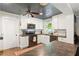 Bright kitchen featuring white cabinets, stainless steel appliances, and modern countertops at 4027 Finch Sw Rd, Powder Springs, GA 30127