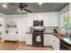 Well lit Kitchen featuring stainless appliances, white cabinetry, and ceiling fan at 4027 Finch Sw Rd, Powder Springs, GA 30127