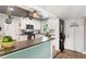 Well-designed kitchen featuring white cabinetry, stainless steel appliances, and a convenient breakfast bar at 4027 Finch Sw Rd, Powder Springs, GA 30127
