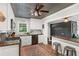Modern kitchen with white cabinets, stainless steel appliances, and stylish bar seating area at 4027 Finch Sw Rd, Powder Springs, GA 30127