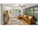 Elegant living area with hardwood floors, modern furnishings, and an attractive accent wall at 4027 Finch Sw Rd, Powder Springs, GA 30127