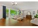 Spacious living room with large windows offering picturesque outdoor views at 4027 Finch Sw Rd, Powder Springs, GA 30127